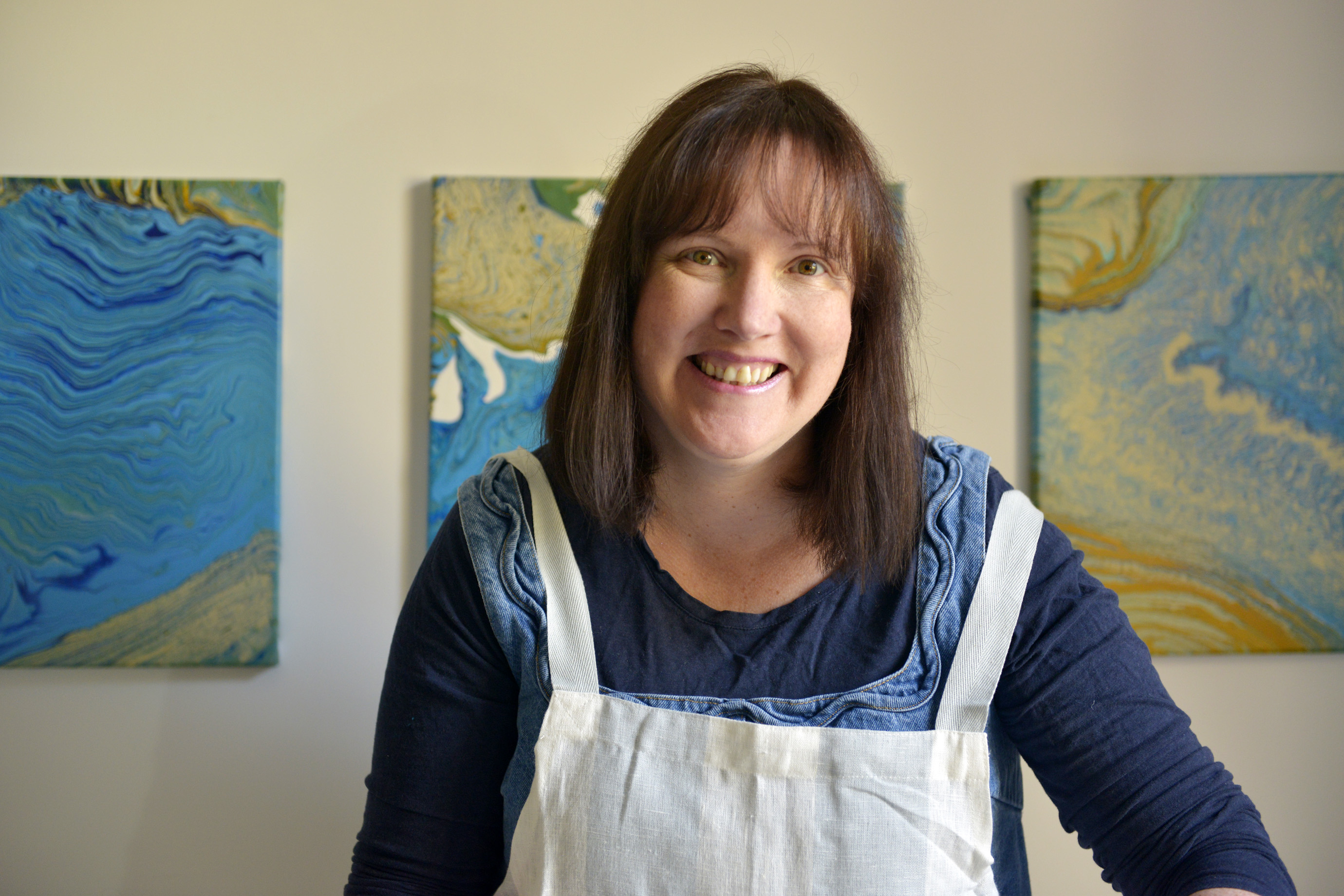 Woman happily creating art in a studio